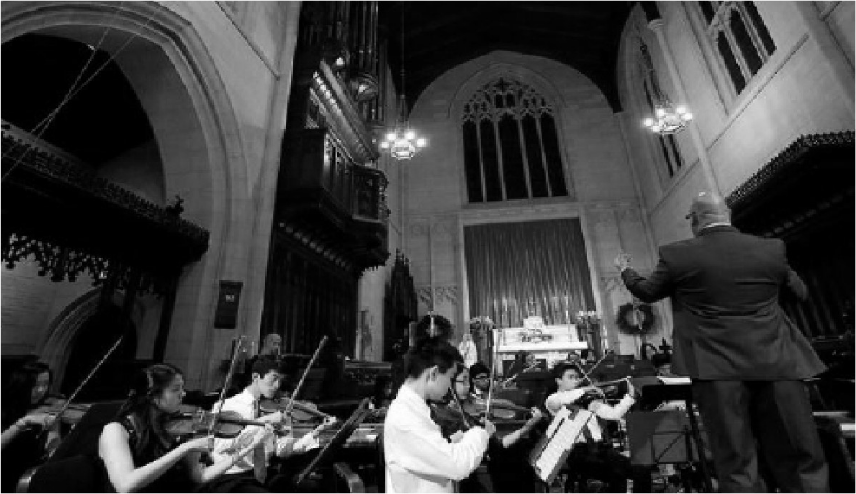 The+chamber+orchestra+performs+at+Lessons+and+Carols.