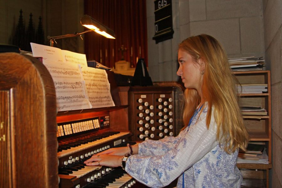 Chip practicing organ in the chapel.