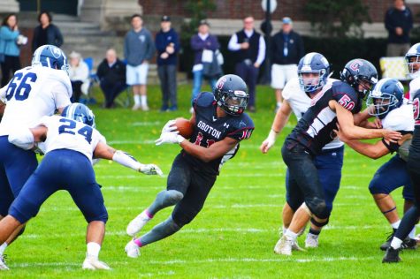 Caleb Coleman '20 weaving through Noble’s defensive line.