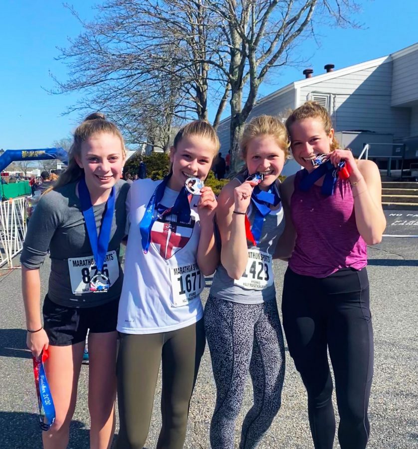 Runners Olivia Dillon 21, Hannah Wise 21, Cornelia Potter 21, and Anna Copeland 20 after finishing the half-marathon. 